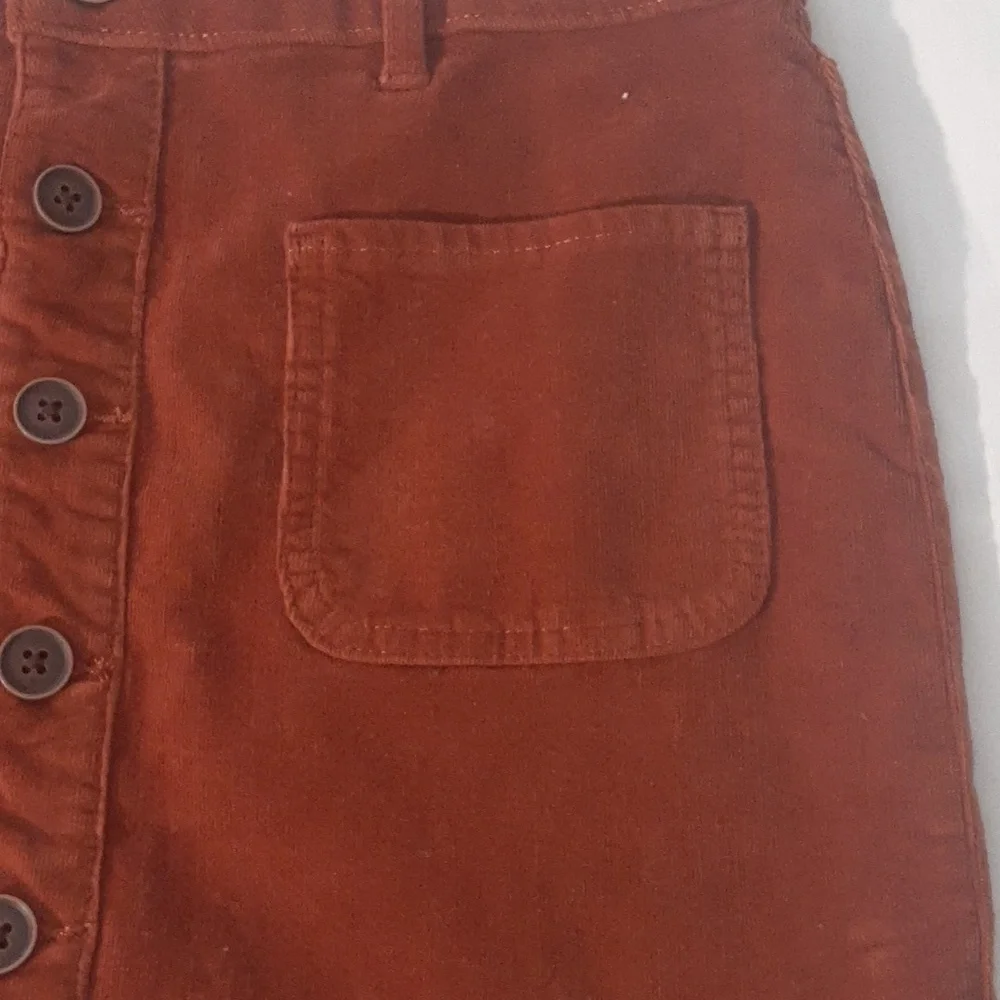 SO Girls Size 16 Corduroy skirt. Burnt‎ Orange, NWOT. Waist sinches to fit.